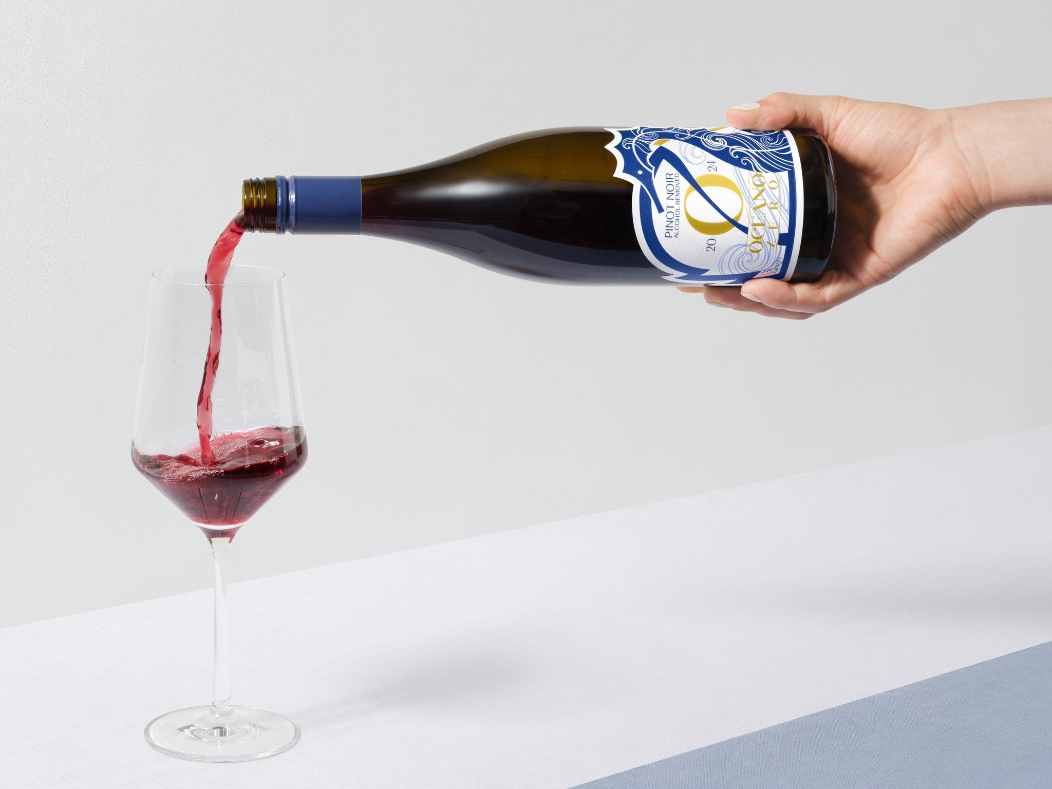 2024 Pinot Noir — being poured into a glass